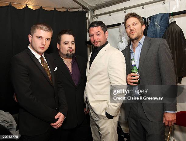 Plan B and Fun Lovin' Criminals members Frank Benbini, Huey Morgan and Brian Leiser pose backstage during a recording of the 'Evo Music Rooms' for...