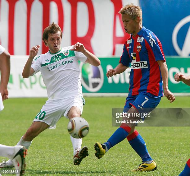 Keisuke Honda of PFC CSKA Moscow battles for the ball with Andrei Kobenko of FC Terek Grozny during the Russian Football League Championship match...