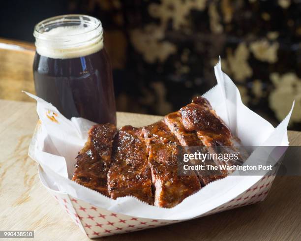 Honey Barbecue glazed spareribs with a dark beer at Fat Pete's is smoked in the J&R Oyler wood-fired pit in Washington, DC on May 16, 2015. The city...