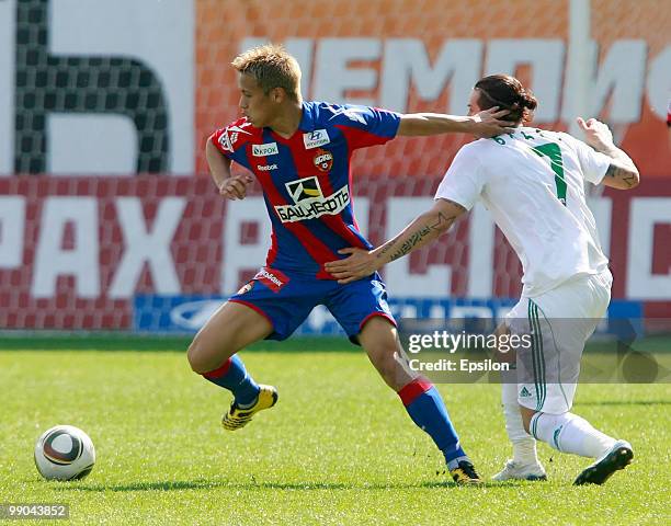 Keisuke Honda of PFC CSKA Moscow battles for the ball with Blagoy Georgiev of FC Terek Grozny during the Russian Football League Championship match...