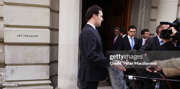 Chancellor of The Exchequer George Osborne talks to reporters as he walks into The Treasury on May 12, 2010 in London, England. After a tightly...