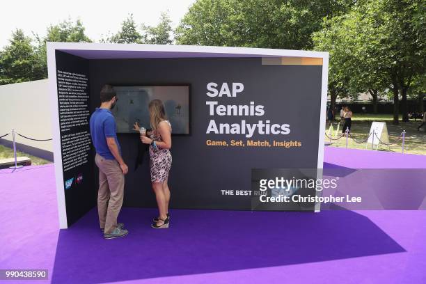 Fans view the displays during the WTA Tennis On The Thames in Bernie Spain Gardens on June 28, 2018 in London, England.
