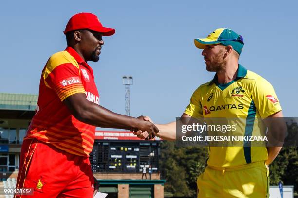 Zimbabwe captain Hamilton Masakadza shakes hands with Aaron Finch of Australia during the third match played between Australia and hosts Zimbabwe as...