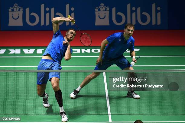 Vladimir Ivanov and Ivan Sozonov of Russia compete against Kasper Antonsen and Niclas Nohr of Denmark during the Men's Doubles Round 1 match on day...