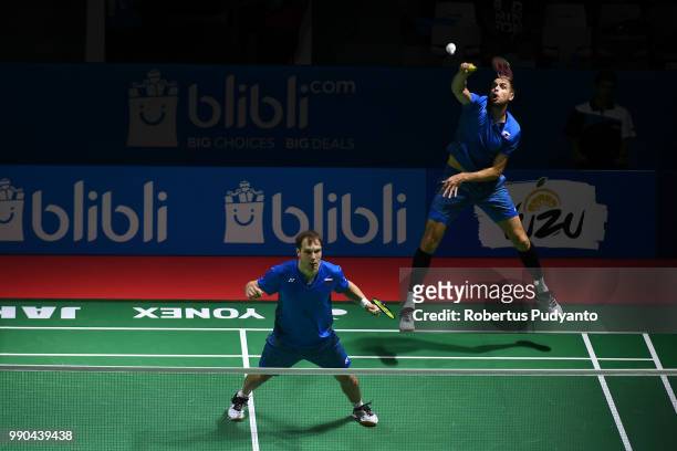 Vladimir Ivanov and Ivan Sozonov of Russia compete against Kasper Antonsen and Niclas Nohr of Denmark during the Men's Doubles Round 1 match on day...
