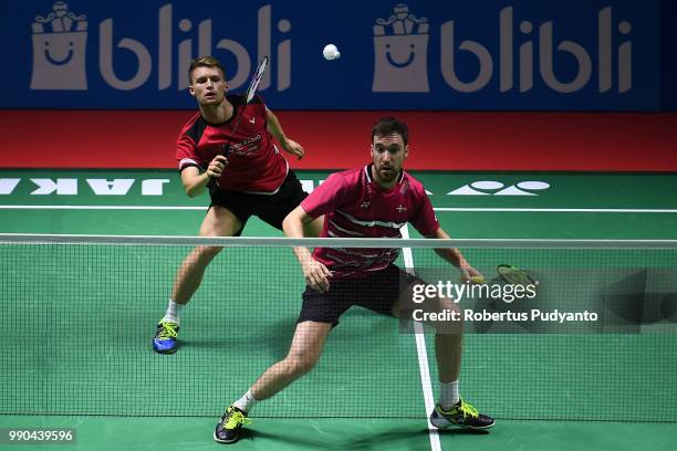 Kasper Antonsen and Niclas Nohr of Denmark compete against Vladimir Ivanov and Ivan Sozonov of Russia during the Men's Doubles Round 1 match on day...