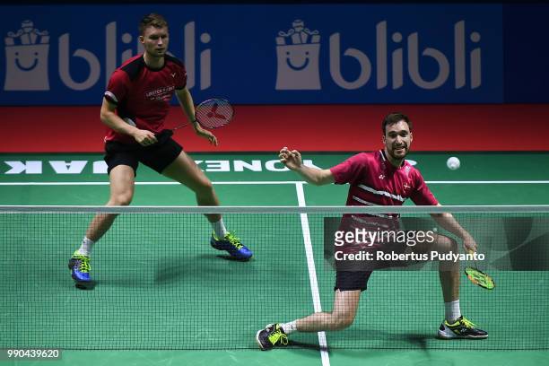 Kasper Antonsen and Niclas Nohr of Denmark compete against Vladimir Ivanov and Ivan Sozonov of Russia during the Men's Doubles Round 1 match on day...