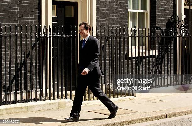 Chancellor of the Exchequer George Osborne walks along Downing Street on May 12, 2010 in London, England. After five days of negotiation a...