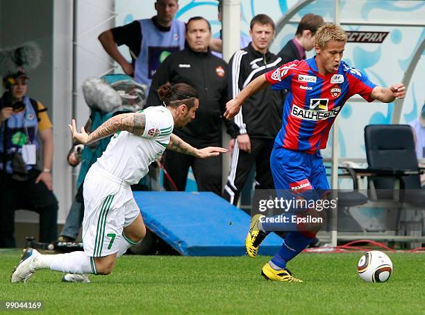 Keisuke Honda of PFC CSKA Moscow battles for the ball with Blagoy Georgiev of FC Terek Grozny during the Russian Football League Championship match...