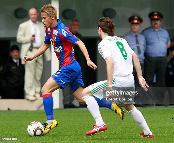 Keisuke Honda of PFC CSKA Moscow battles for the ball with Mauricio of FC Terek Grozny during the Russian Football League Championship match between...