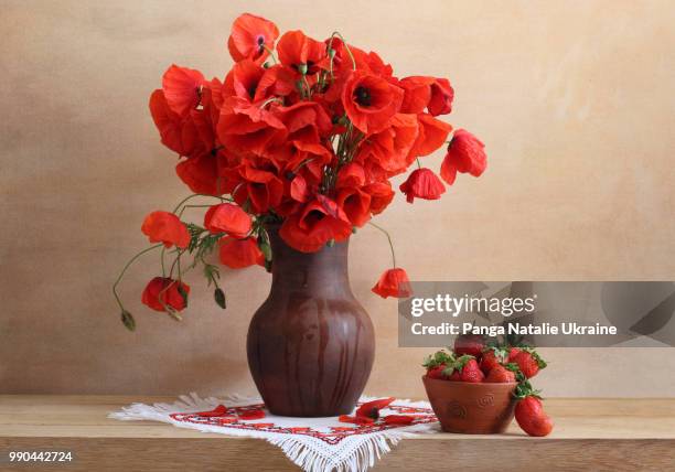 strawberries and bouquet of poppies in misted-up ceramic vase - poppies in vase stock pictures, royalty-free photos & images