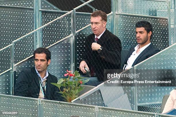Daniel Homedes, an unknown person and Miguel Torres attend the Mutua Madrilena Madrid Open tennis tournament on May 11, 2010 in Madrid, Spain.