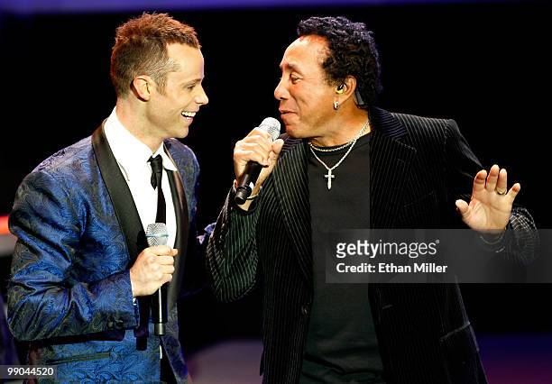 Singer Andrew Tierney of the Australian vocal group Human Nature sings with Motown legend Smokey Robinson during a performance after announcing a...
