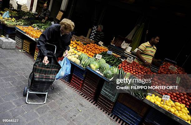 Pensioner shops in Athens central market on May 12, 2010.Greece was to receive a first dose of 5.5 billion euros from the IMF under a massive bailout...