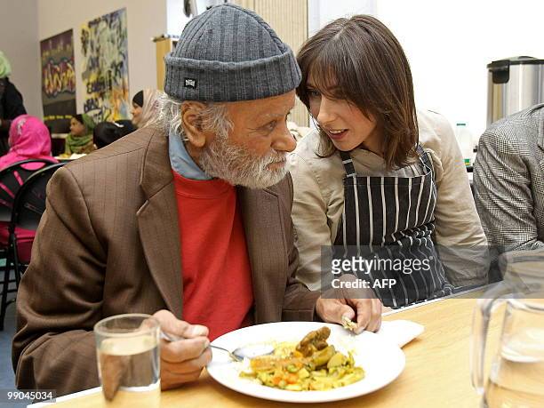 Samantha Cameron , wife of British opposition Conservative party leader David Cameron, talks with diners during her visit to a Community Centre in...