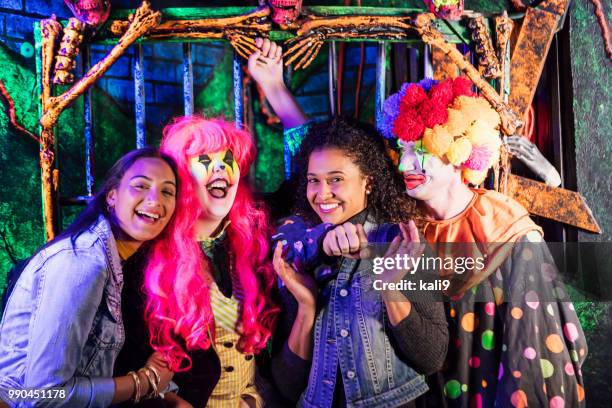 zombie and clown in halloween haunted house - chokehold stock pictures, royalty-free photos & images