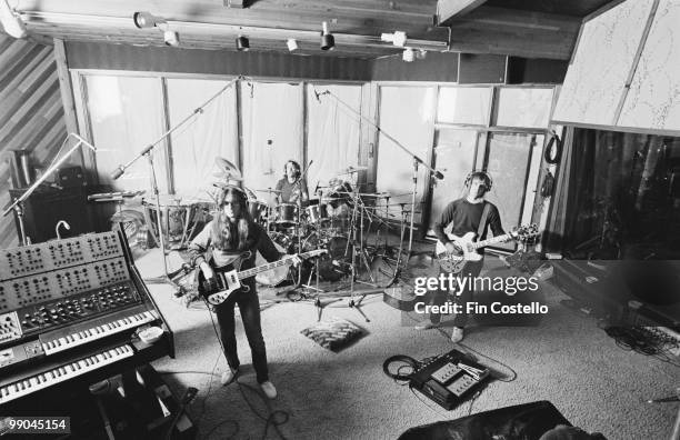 Canadian progressive rock band Rush recording their album 'Permanent Waves' at Le Studio, Morin Heights, Quebec, Canada, October 1979. Left to right:...
