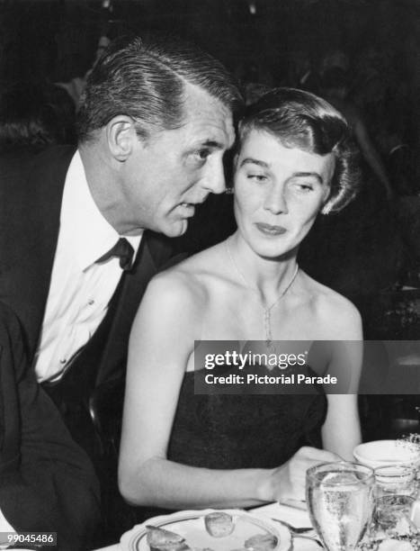 British-American actor Cary Grant with his third wife, actress and writer Betsy Drake, at a nightclub on their wedding anniversary, circa 1950.