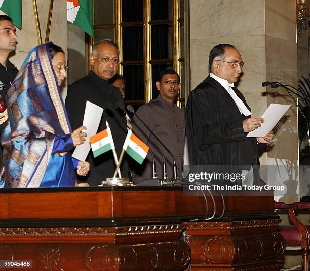 President Pratibha Patil administers oath of secrecy to Justice S.H. Kapadia being sworn in as the new CJI at Rashtrapati Bhavan in New Delhi on May...