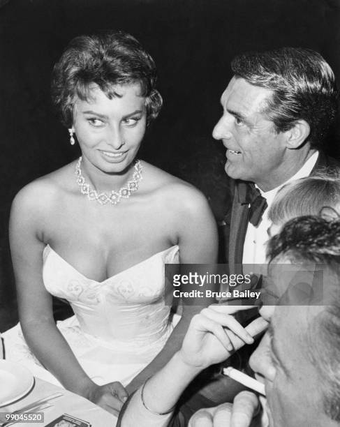 British-American actor Cary Grant with Italian actress Sophia Loren at the Beverly Hilton Hotel, after the premiere of their film 'The Pride and the...