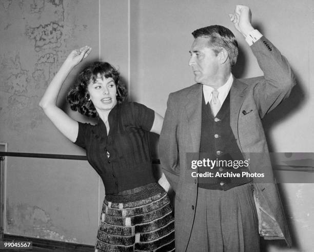 Italian actress Sophia Loren teaches co-star Cary Grant to dance the Flamenco, during the filming of 'The Pride and the Passion', 1957.