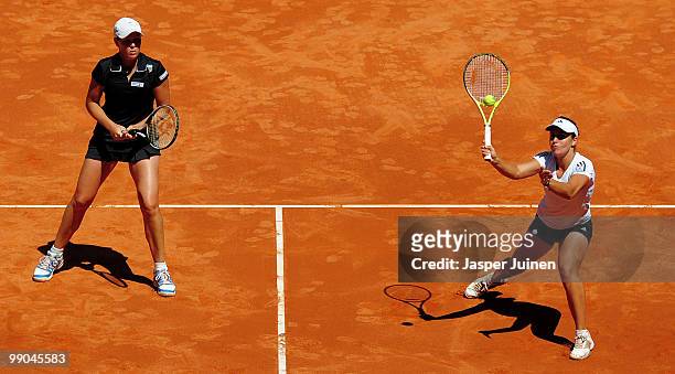 Anabel Medina Garrigues of Spain plays a forehand with her doubles partner Liezel Huber of the USA in their second round match against Chia-Jung...