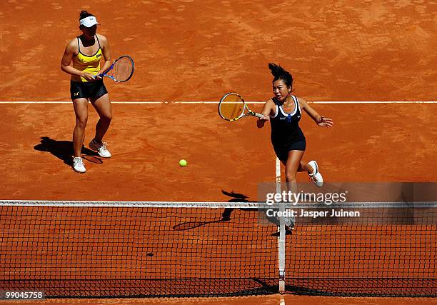 Chia-Jung Chuang of Taipei plays a forehand with her doubles partner Vania King of the USA in their second round match against Liezel Huber of the...