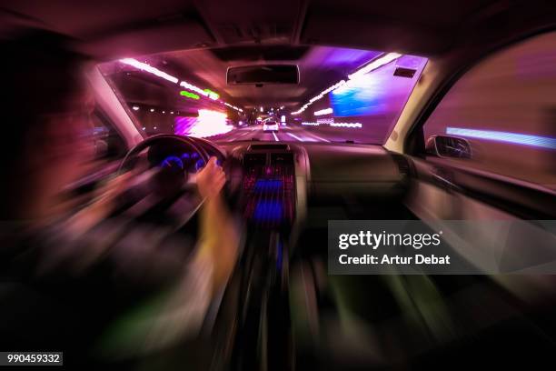 driving at night by car with motion. - debat fotografías e imágenes de stock