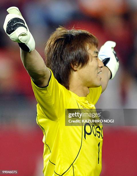 South Korea's Pohang Steelers goalkeeper Shin Hwa Young reacts as he celebreates his team's win over Japan's Kashima Antlers at the end of the AFC...