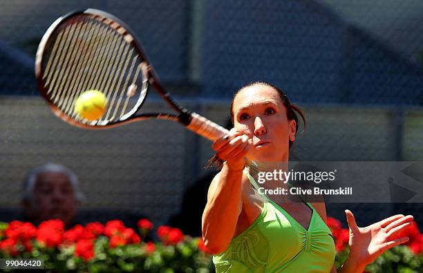 Jelena Jankovic of Serbia plays a forehand against Ana Ivanovic of Serbia in their second round match during the Mutua Madrilena Madrid Open tennis...