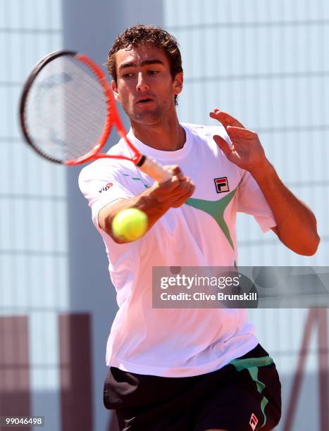 Marin Cilic of Croatia plays a forehand against Eduardo Schwank of Argentina in their second round match during the Mutua Madrilena Madrid Open...