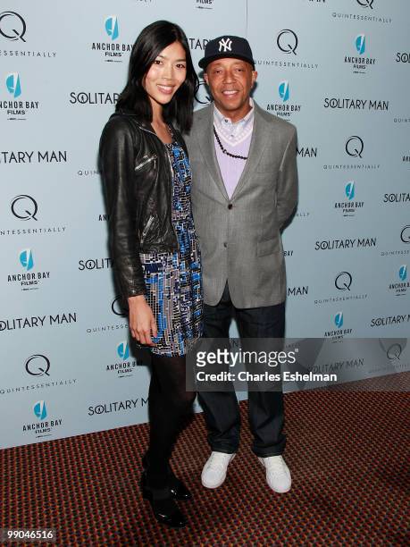 Model Angie Hsu and Russell Simmons attend the premiere of "Solitary Man" at Cinema 2 on May 11, 2010 in New York City.