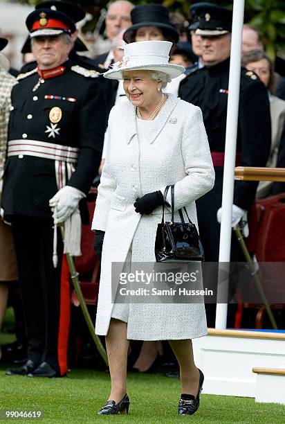 Queen Elizabeth II arrives to review of the Company of Pikemen and Musketeers at HAC Armoury House on May 12, 2010 in London, England.