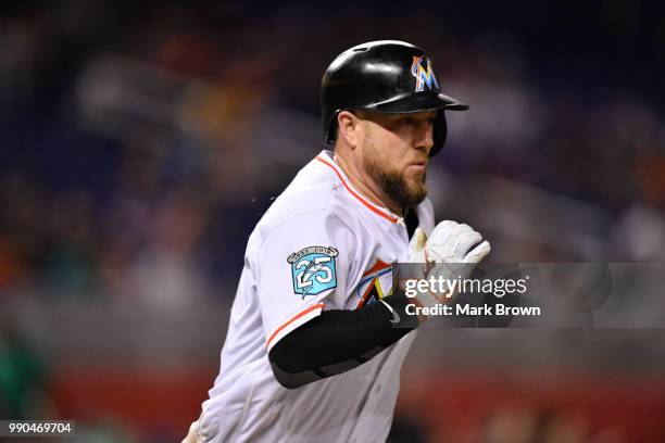 Bryan Holaday of the Miami Marlins runs to first base during the game against the Arizona Diamondbacks at Marlins Park on June 27, 2018 in Miami,...