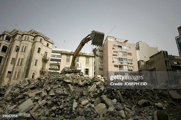 Bulldozer demolishes an old traditional building at a neighbourhood in central Beirut on March 12, 2010. Most of Beirut's traditional architecture is...