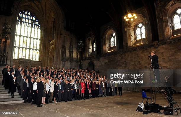 The majority of the 232 new MP's, elected in last week's General Election, pose for a group picture, with Doormen in Westminster Hall, on May 12,...