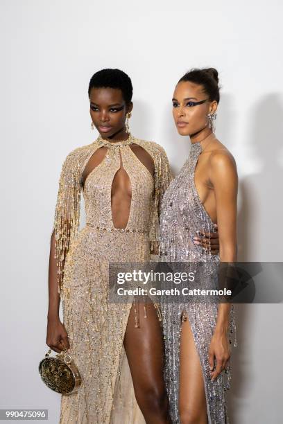 Maria Borges and Cindy Bruna backstage before the Georges Hobeika Haute Couture Fall Winter 2018/2019 show as part of Paris Fashion Week on July 2,...