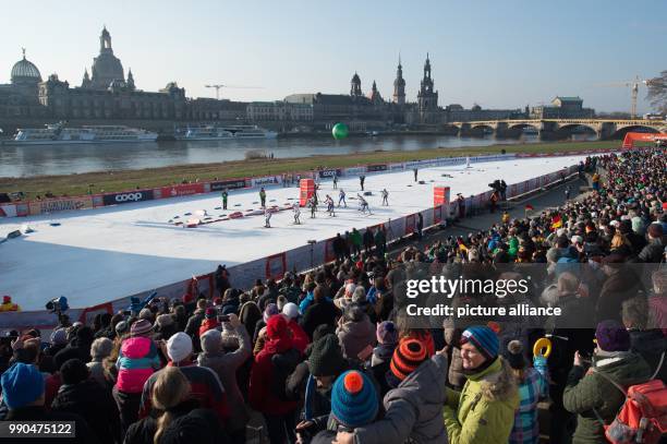 Cross country female athletes on the route are watched by the audience during the women's freestyle team sprint 6 x 1.2 km final event at the Cross...