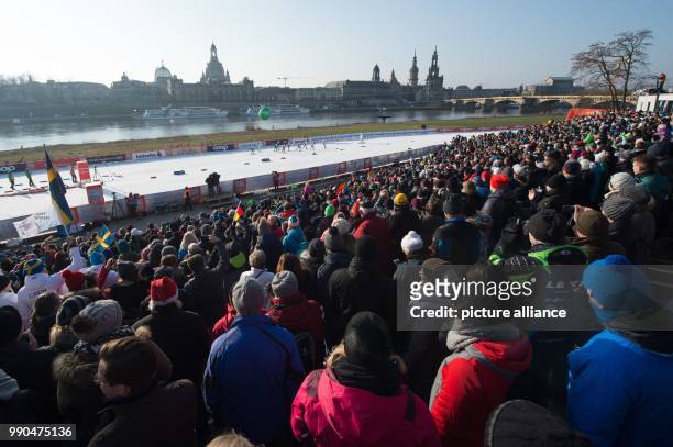 Cross country female athletes on the route are watched by the audience during the women's freestyle team sprint 6 x 1.2 km final event at the Cross...