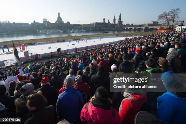 Cross country female athletes on the route are watched by the audience during the women's freestyle team sprint 6 x 1.2 km final event at the Cross...