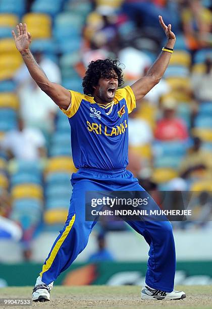 Sri Lankan cricketer Lasith Malinga celebrates after taking the wicket of West Indian cricketer Jerome Taylor during The ICC World Twenty20 Super 8...