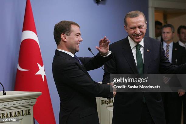 Russian President Dmitry Medvedev and Turkish President Abdullah Gul shake hands at a joint press conference at the presidential palace on May 12,...