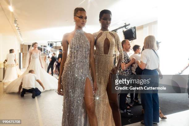 Cindy Bruna and Maria Borges backstage before the Georges Hobeika Haute Couture Fall Winter 2018/2019 show as part of Paris Fashion Week on July 2,...