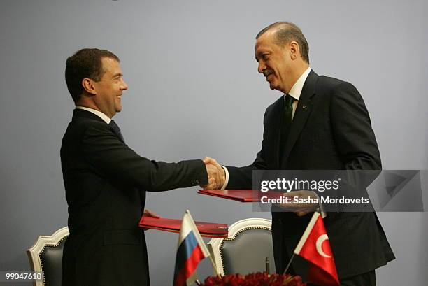 Russian President Dmitry Medvedev and Turkish President Abdullah Gul shake hands at a joint press conference at the presidential palace on May 12,...