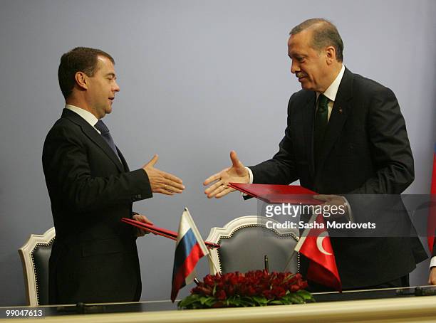 Russian President Dmitry Medvedev and Turkish President Abdullah Gul shake hands at a joint press conference at the presidential palace on May 12,...