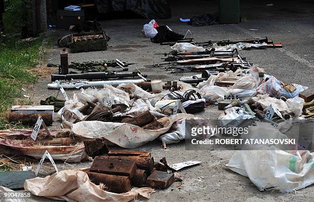 Picture of weapons seized and evidence pictured near the van seized after a shootout, in Skopje, Macedonia, on May 12, 2010. Four people were killed...