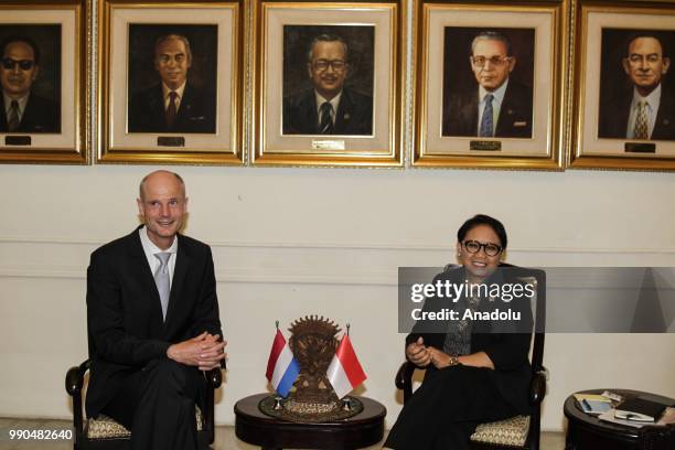 Dutch Foreign Minister Stephanus Abraham Blok meets with his Indonesian counterpart Retno Marsudi during their meeting at the Pancasila building, the...