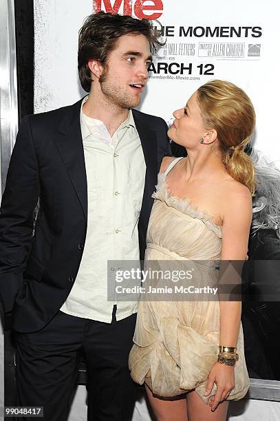 Actor Robert Pattinson and actress Emilie de Ravin attend the premiere of "Remember Me" at the Paris Theatre on March 1, 2010 in New York City.