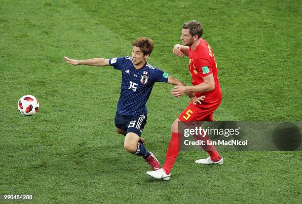 Yuya Osako of Japan vies with Jan Vertonghen of Belgium during the 2018 FIFA World Cup Russia Round of 16 match between Belgium and Japan at Rostov...