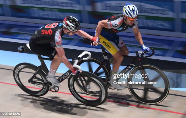 German professional cyclist Theo Reinhardt and Belgian Kenny De Ketele change during the 54th Six-Day Race in the ÖVB-Arena in Bremen, 14 January...